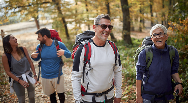 Group of people hiking in a wooded area